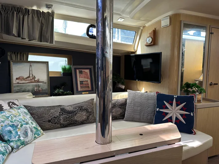  Yacht Photos Pics Interior of 2017 Beneteau Oceanis 41.1 yacht with cozy seating and nautical decor.