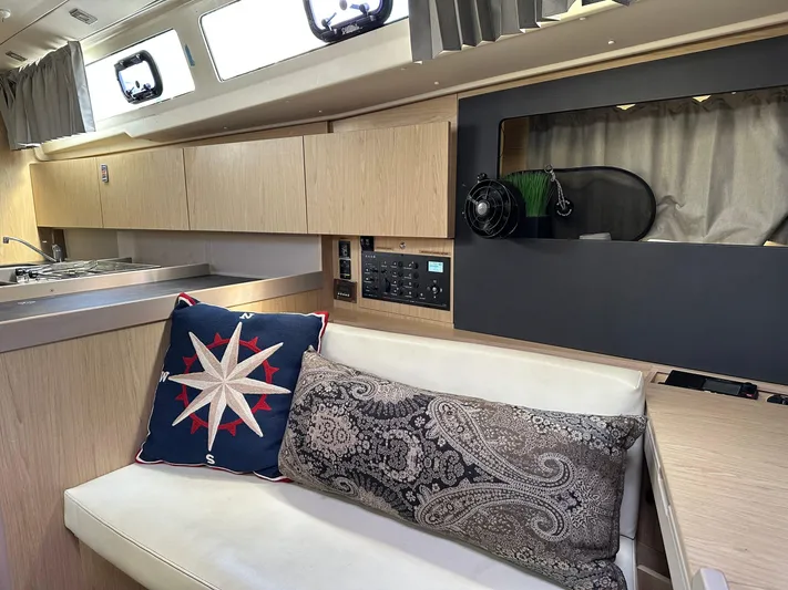  Yacht Photos Pics Interior of 2017 Beneteau Oceanis 41.1 yacht with modern seating and nautical decor.