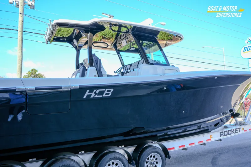  Yacht Photos Pics 2023 HCB 39 Speciale boat on trailer at dealership, side view.