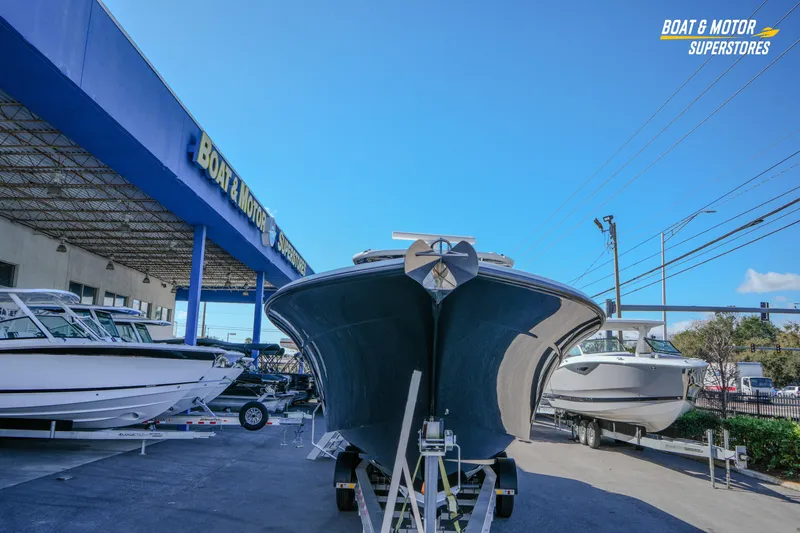  Yacht Photos Pics 2023 HCB 39 Speciale boat displayed at Boat & Motor Superstores under clear blue sky.