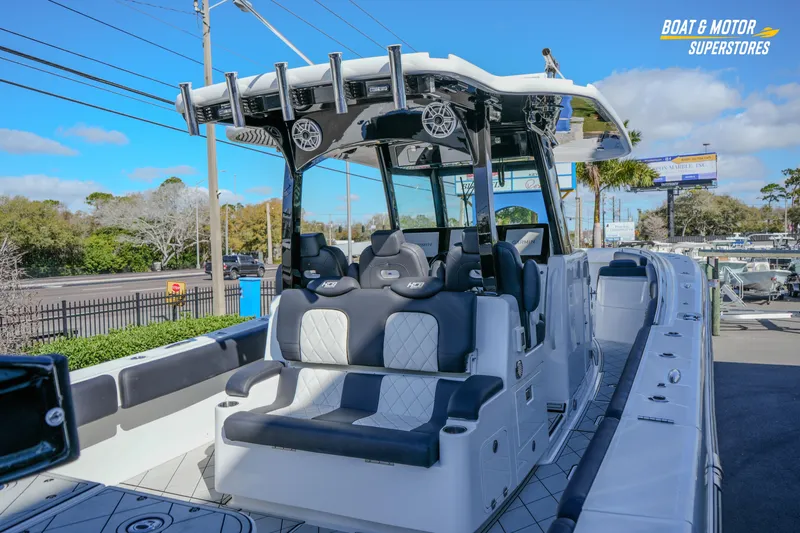  Yacht Photos Pics 2023 HCB 39 Speciale boat with luxurious seating and modern design at a dealership.