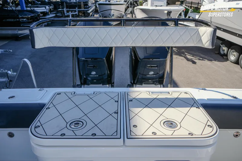  Yacht Photos Pics 2023 HCB 39 Speciale boat with dual Mercury Verado engines, docked at a marina.