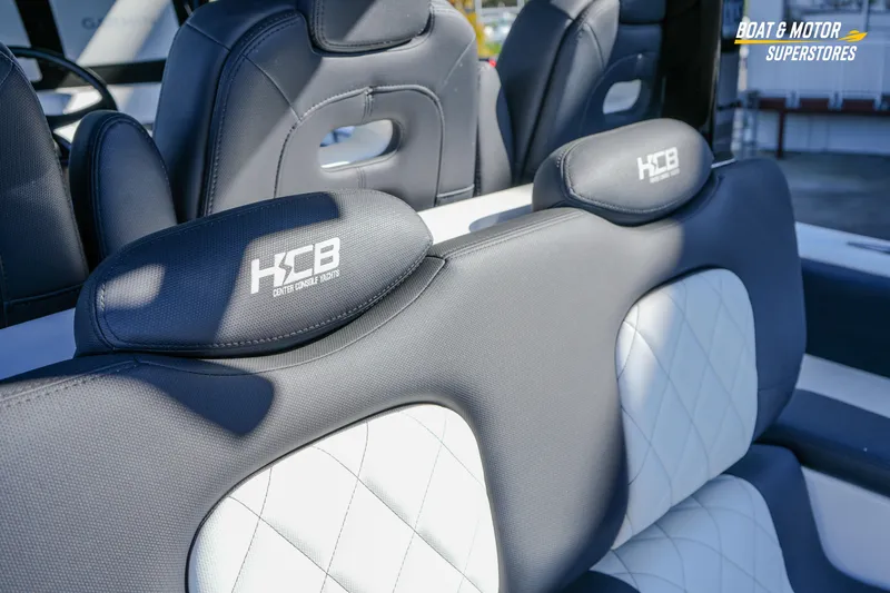  Yacht Photos Pics 2023 HCB 39 Speciale boat seats with logo, featuring luxurious black and white upholstery.