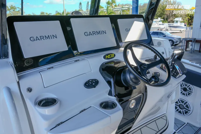  Yacht Photos Pics 2023 HCB 39 Speciale boat dashboard with Garmin displays and steering wheel.