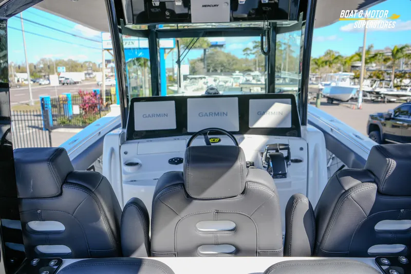  Yacht Photos Pics 2023 HCB 39 Speciale boat interior with Garmin navigation displays and luxurious seating.