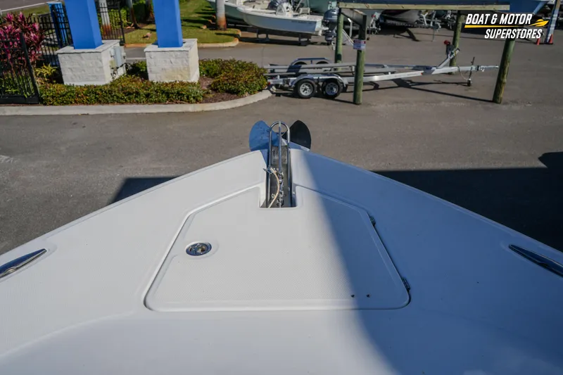  Yacht Photos Pics Bow view of 2023 HCB 39 Speciale boat at dealership, showcasing anchor and deck.