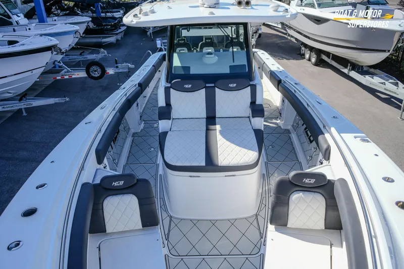  Yacht Photos Pics 2023 HCB 39 Speciale boat with luxurious seating and sleek design at a dealership.