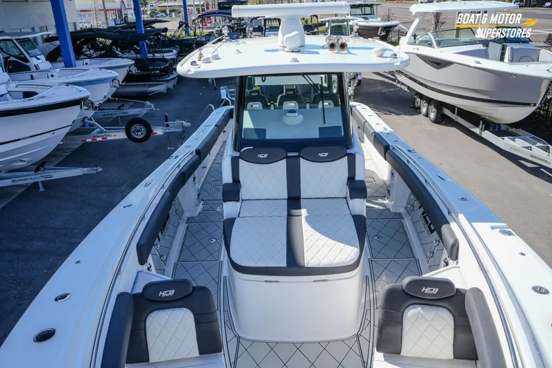  Yacht Photos Pics 2023 HCB 39 Speciale boat with luxurious seating at a dealership.