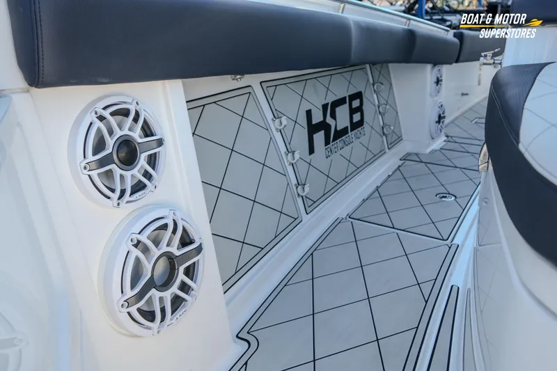  Yacht Photos Pics 2023 HCB 39 Speciale boat interior with speakers and cushioned seating.