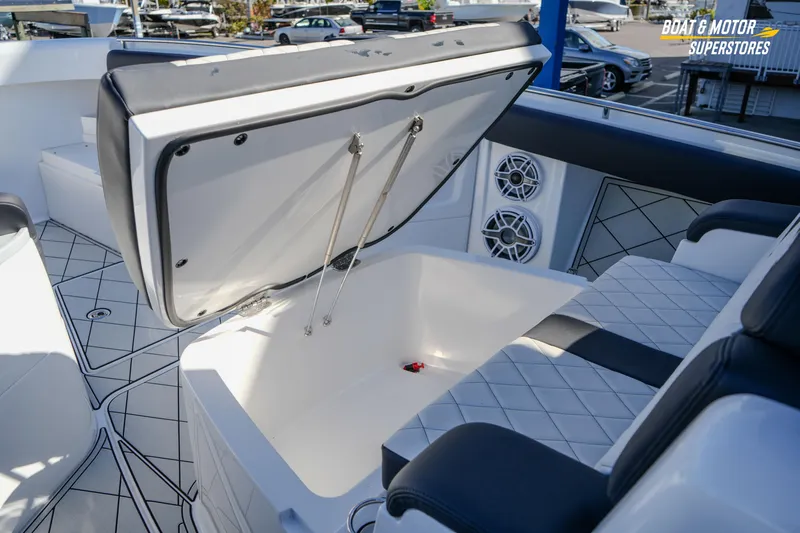  Yacht Photos Pics 2023 HCB 39 Speciale boat interior with open storage compartment and luxury seating.