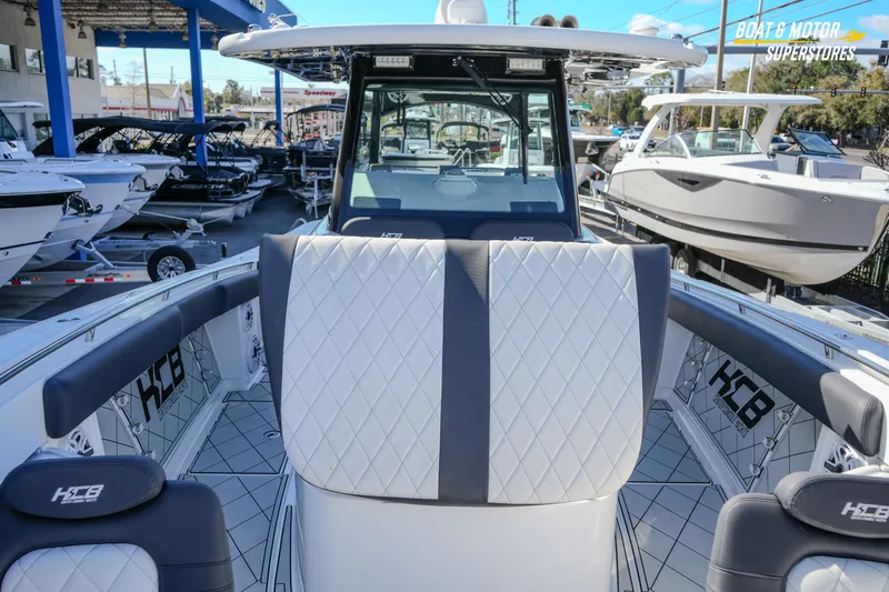  Yacht Photos Pics 2023 HCB 39 Speciale boat interior with luxurious seating at a dealership.