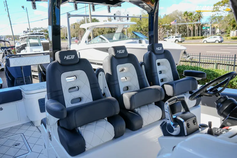  Yacht Photos Pics 2023 HCB 39 Speciale boat interior with luxury seating and steering console.