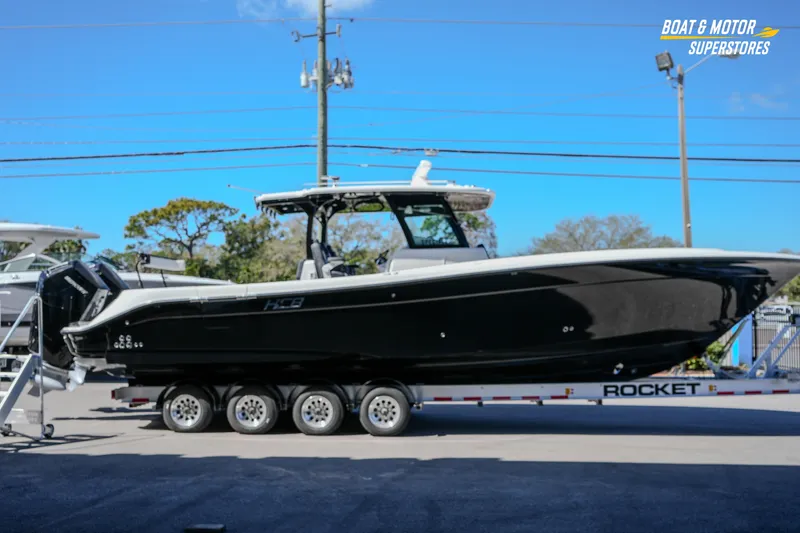  Yacht Photos Pics 2023 HCB 39 Speciale boat on trailer at dealership, side view.