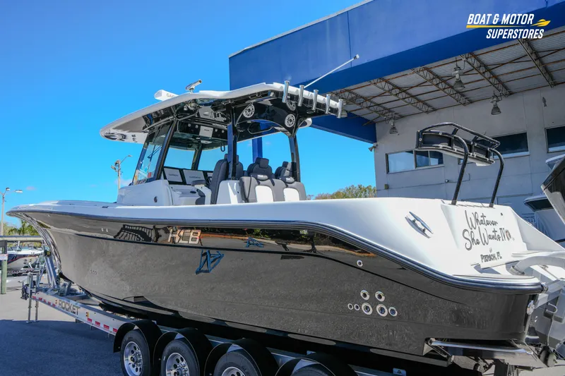  Yacht Photos Pics 2023 HCB 39 Speciale boat on trailer at dealership, side view.