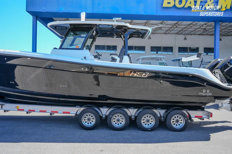  Yacht Photos Pics 2023 HCB 39 Speciale boat on trailer at dealership, side view.