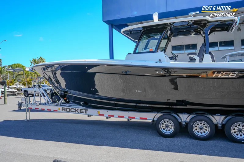  Yacht Photos Pics 2023 HCB 39 Speciale boat on trailer at dealership, side view.
