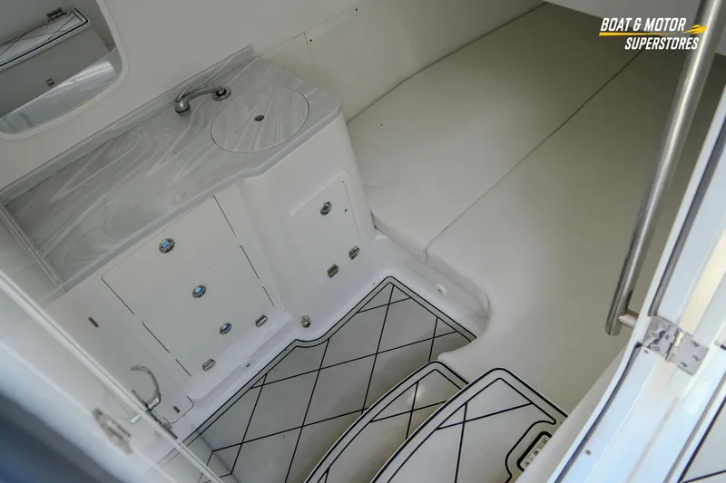  Yacht Photos Pics 2023 HCB 39 Speciale boat interior with sink, storage, and cushioned seating area.