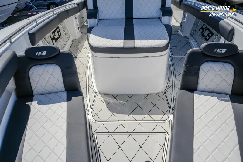  Yacht Photos Pics 2023 HCB 39 Speciale boat interior with luxurious seating and diamond-patterned upholstery.