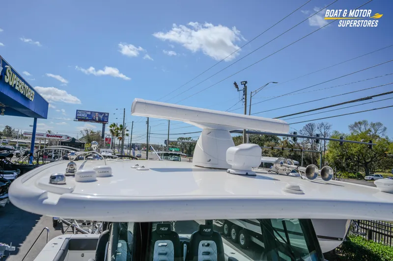  Yacht Photos Pics 2023 HCB 39 Speciale boat at dealership, featuring advanced navigation equipment under clear skies.