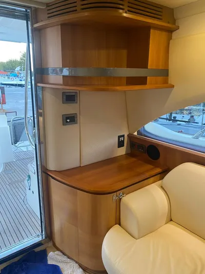  Yacht Photos Pics Interior of 2006 Azimut 50 yacht with wooden cabinetry and cream seating.