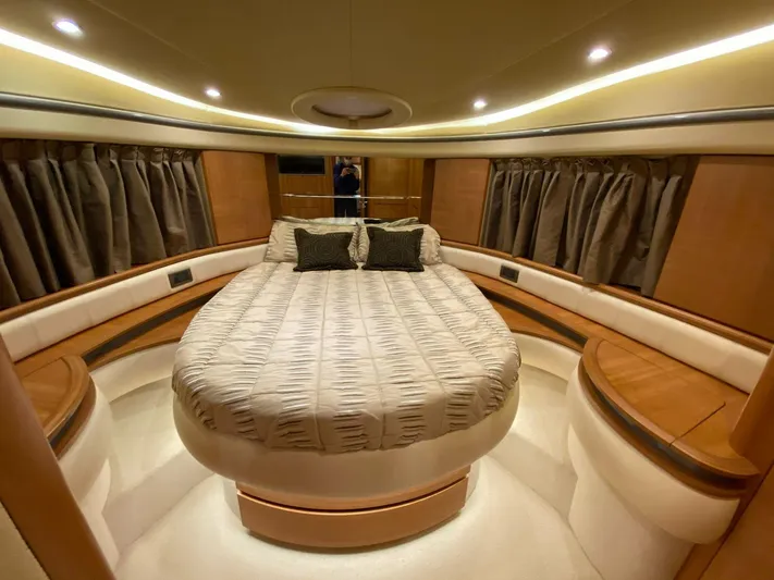  Yacht Photos Pics Luxurious bedroom interior of 2006 Azimut 50 yacht with elegant lighting and plush bedding.
