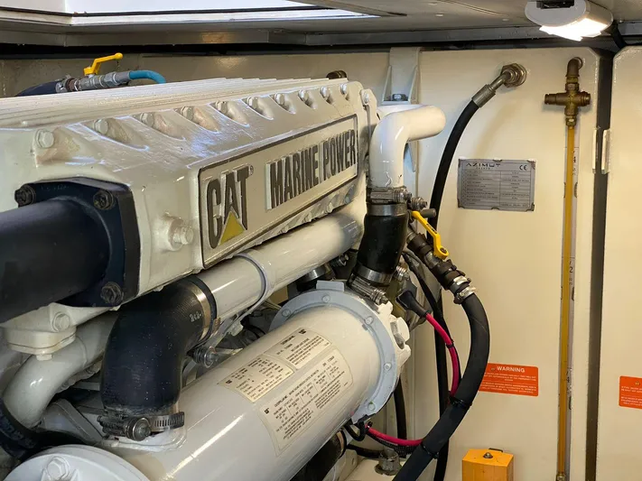  Yacht Photos Pics Engine room of a 2006 Azimut 50 yacht featuring a CAT Marine Power engine.