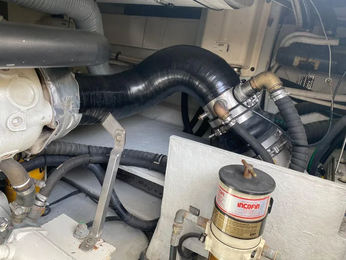  Yacht Photos Pics Engine compartment of a 2006 Azimut 50 yacht, featuring hoses and mechanical components.