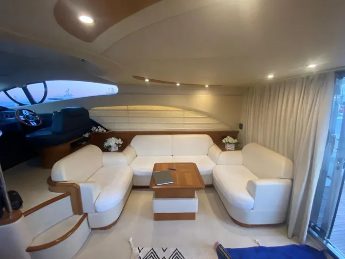  Yacht Photos Pics Luxurious interior of a 2006 Azimut 50 yacht with elegant white seating and wooden accents.