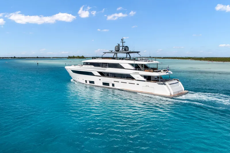 Navetta Yacht Photos Pics Luxurious 2023 Custom Line NAVETTA 42 yacht cruising in clear blue waters.