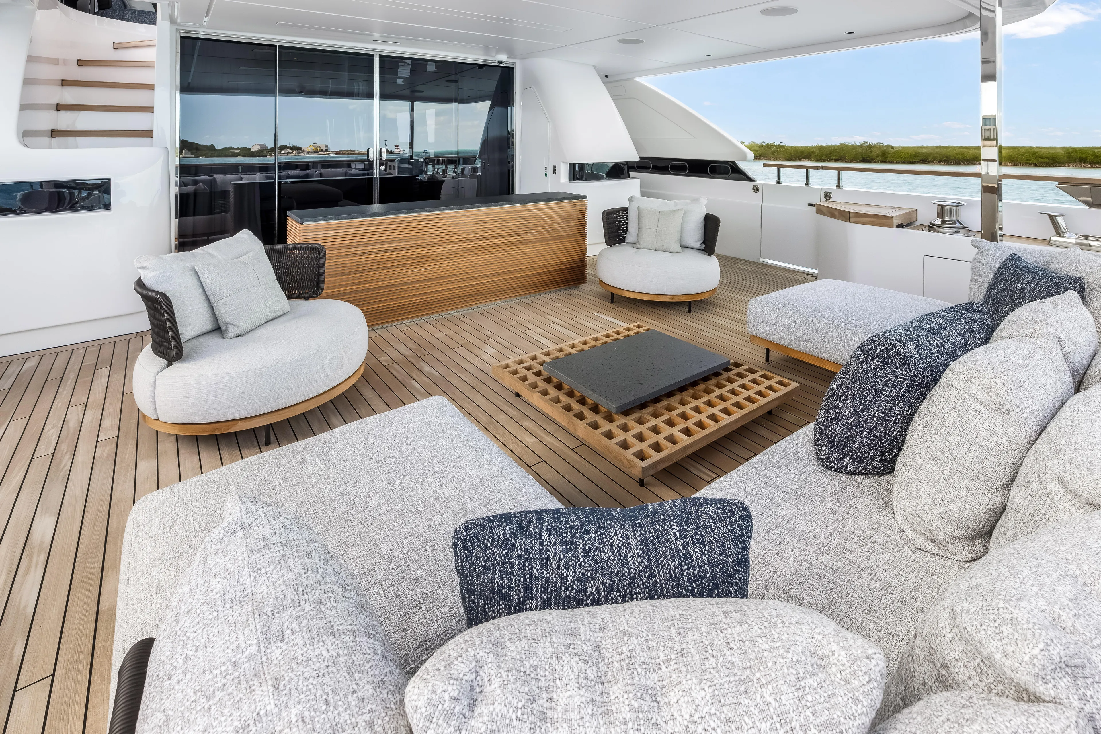 Navetta Yacht Photos Pics Luxurious 2023 Custom Line NAVETTA 42 yacht deck with modern seating and elegant design.
