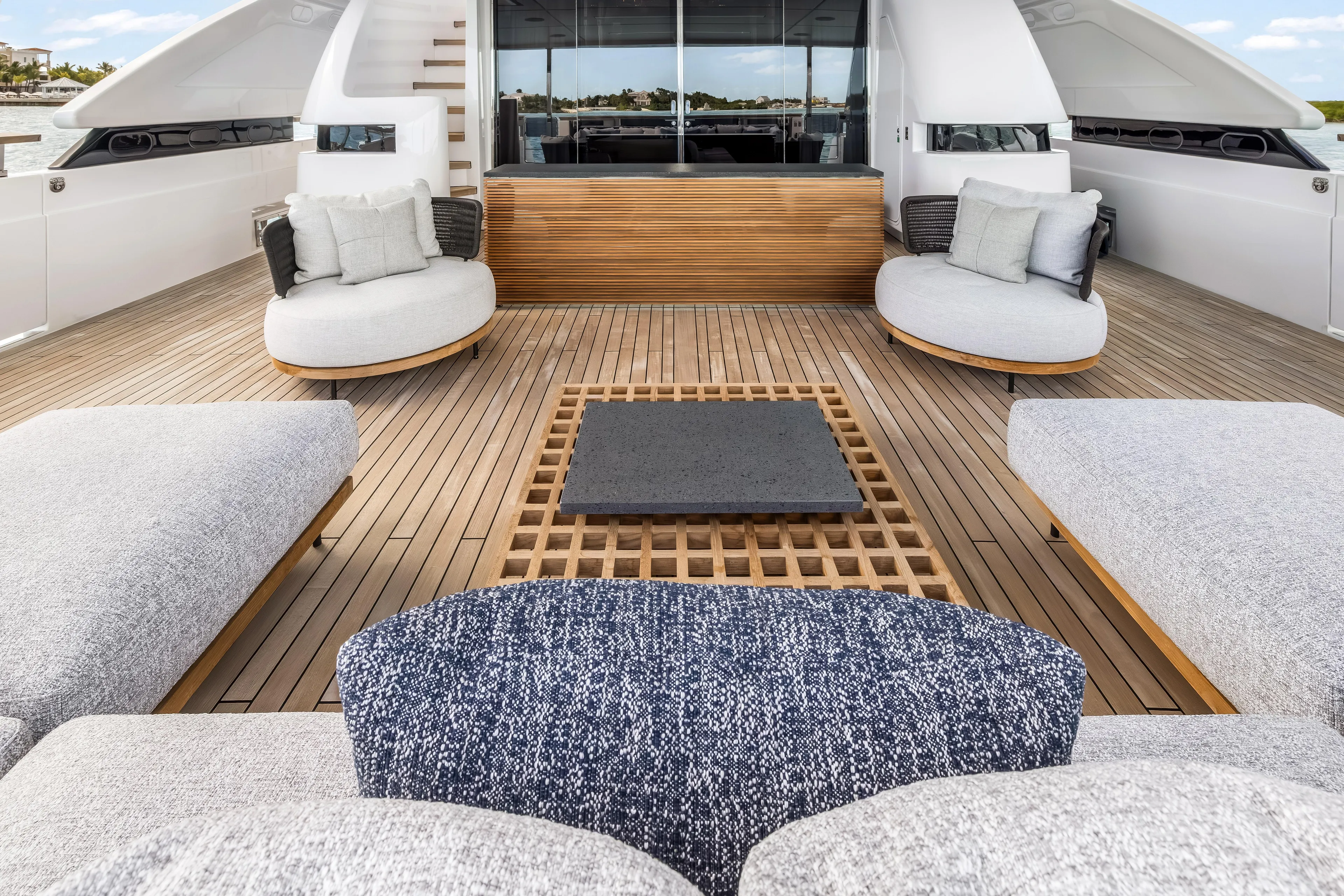 Navetta Yacht Photos Pics Luxurious 2023 Custom Line NAVETTA 42 yacht deck with modern seating and elegant design.