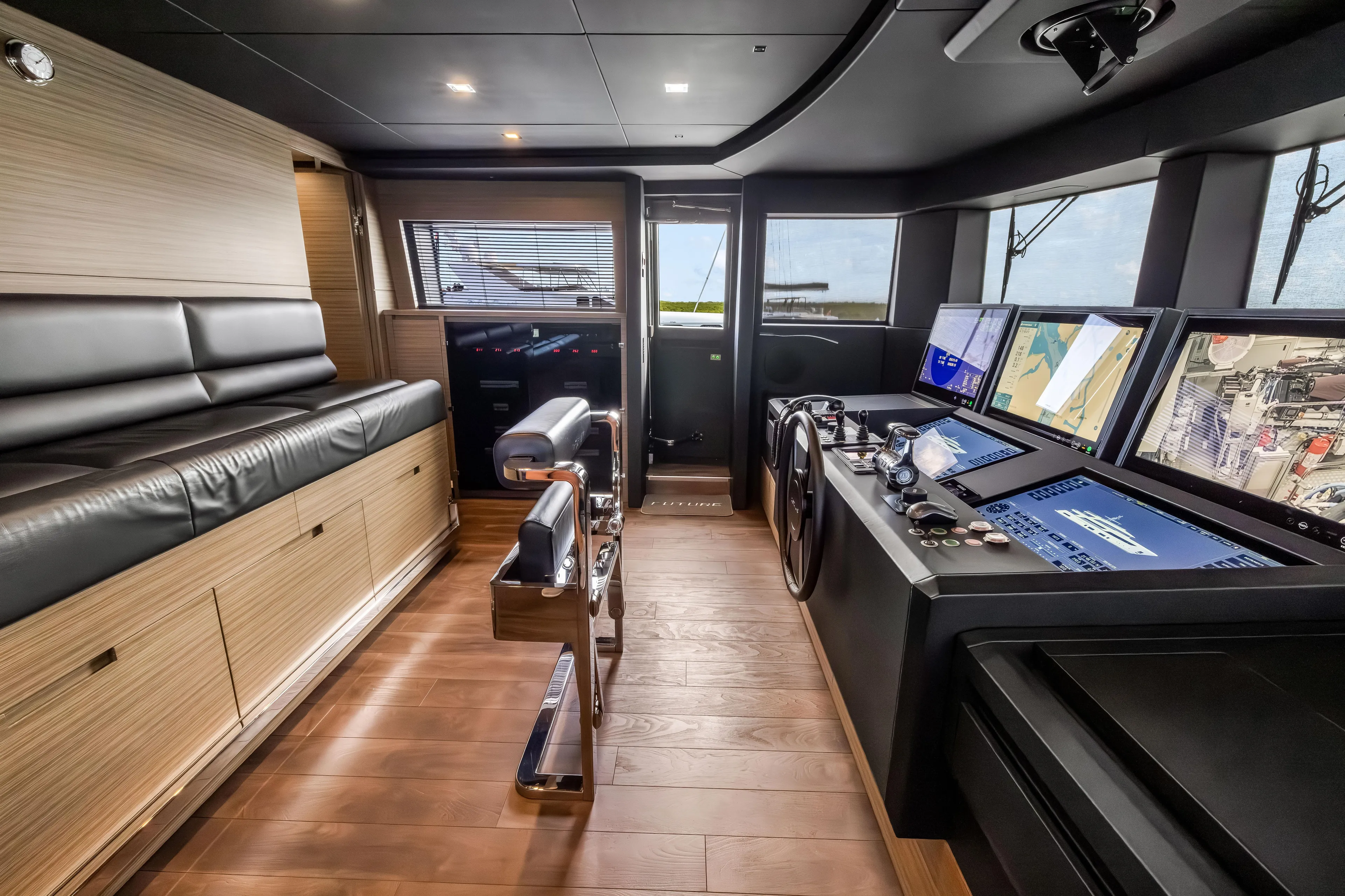 Navetta Yacht Photos Pics Luxurious 2023 Custom Line NAVETTA 42 yacht interior with modern navigation controls and seating.