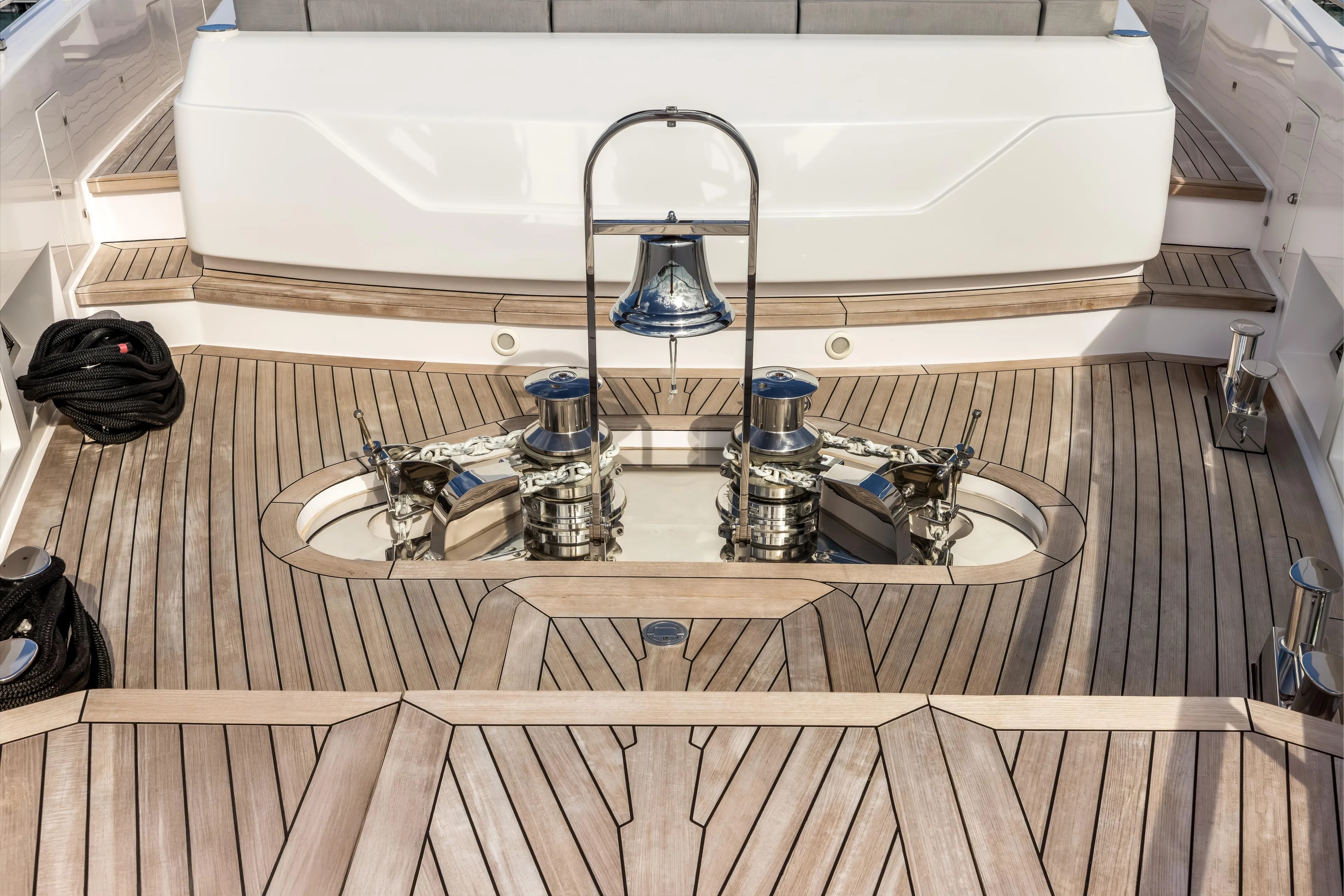 Navetta Yacht Photos Pics Luxurious 2023 Custom Line NAVETTA 42 yacht deck with polished wood and chrome details.