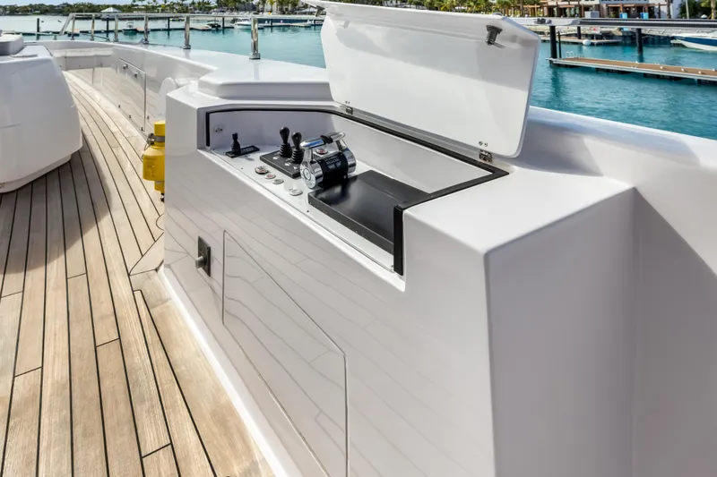 Navetta Yacht Photos Pics Luxury yacht NAVETTA 42, 2023 model, featuring sleek deck controls and ocean backdrop.