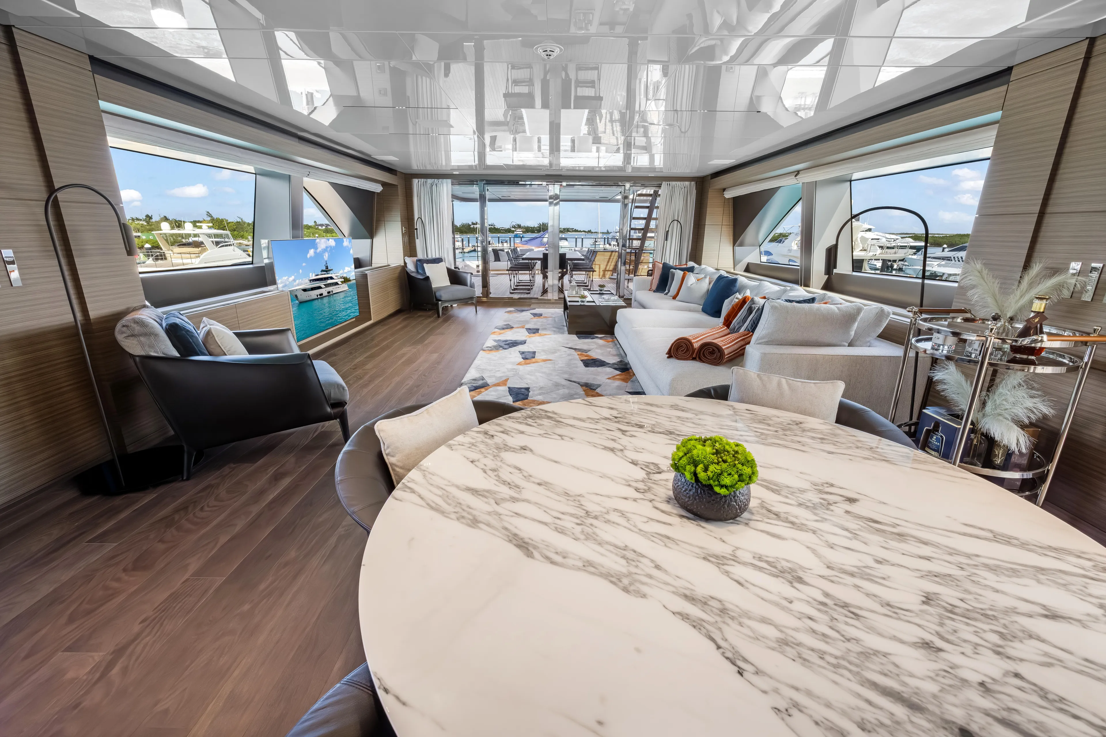 Navetta Yacht Photos Pics Luxurious interior of 2023 Custom Line NAVETTA 42 yacht with elegant furnishings and panoramic views.