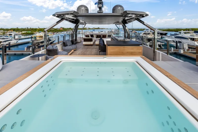 Navetta Yacht Photos Pics Luxurious 2023 Custom Line NAVETTA 42 yacht with jacuzzi and spacious deck at marina.