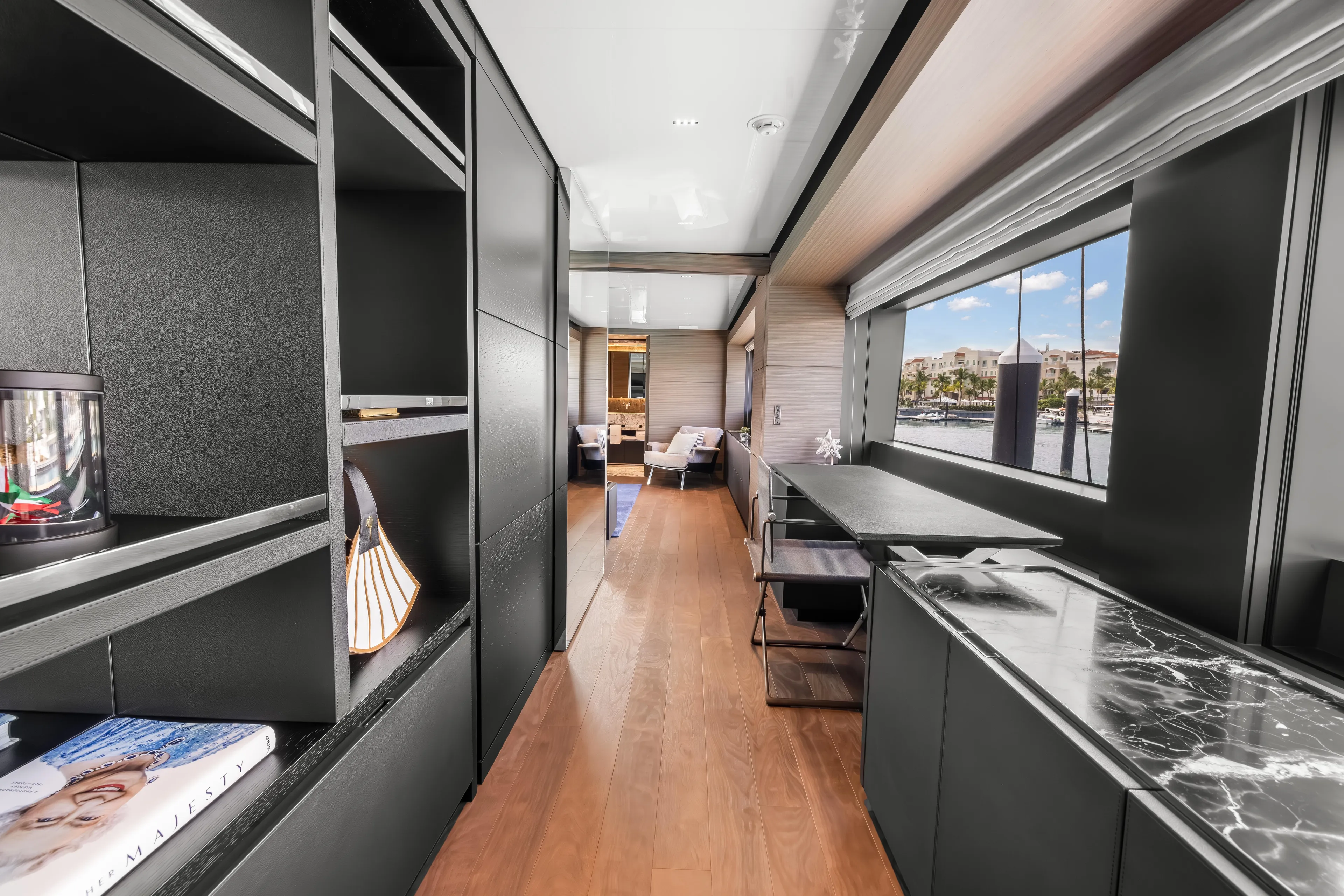 Navetta Yacht Photos Pics Luxurious interior of 2023 Custom Line NAVETTA 42 yacht with modern furnishings and large windows.