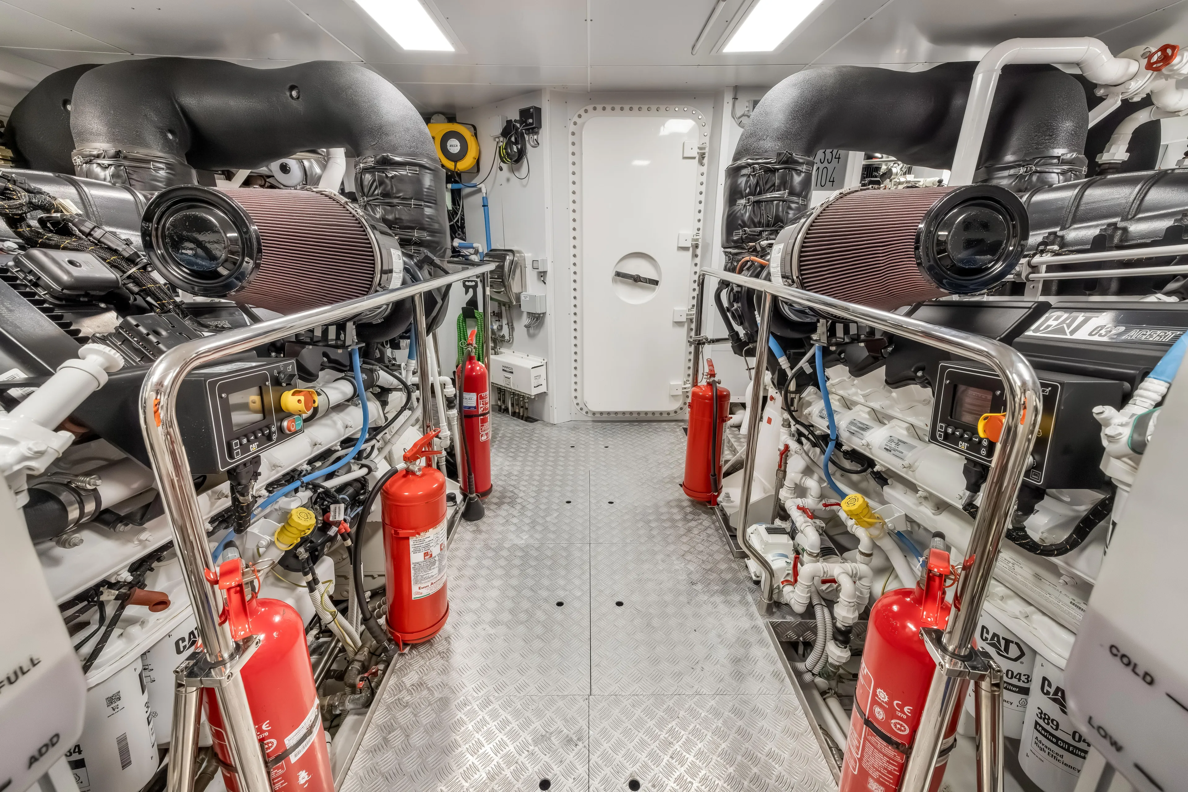 Navetta Yacht Photos Pics Engine room of 2023 Custom Line NAVETTA 42 yacht, featuring advanced machinery and safety equipment.