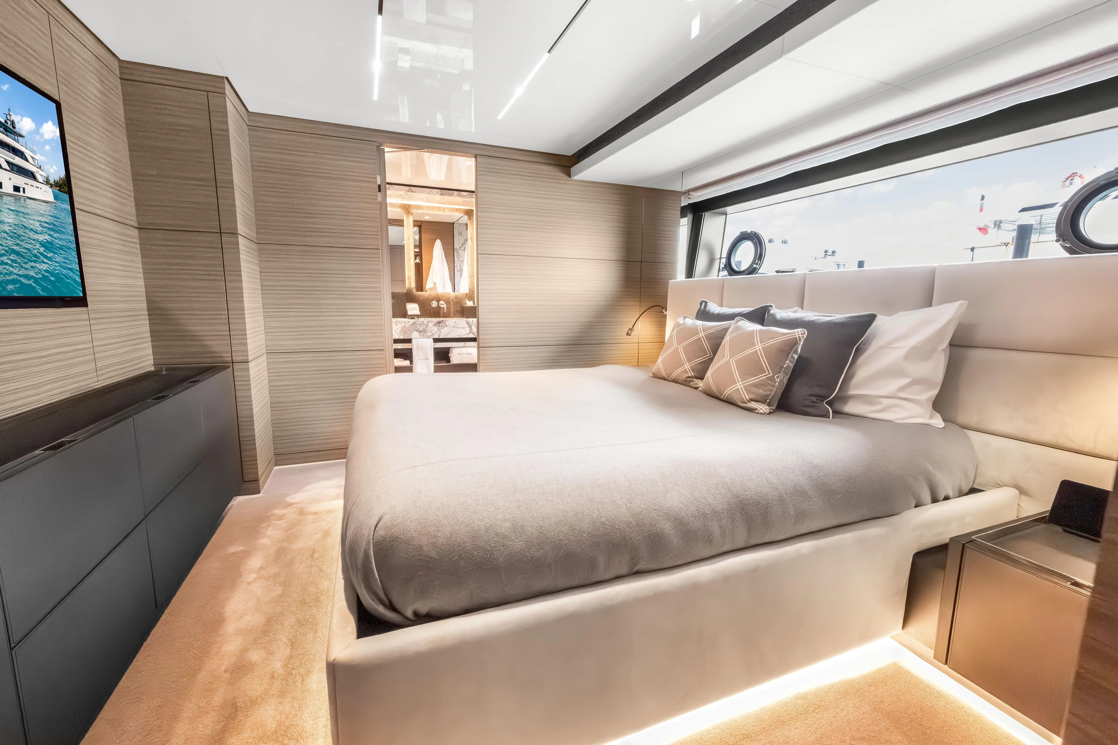 Navetta Yacht Photos Pics Luxurious bedroom interior of 2023 Custom Line NAVETTA 42 yacht, featuring elegant design and modern amenities.