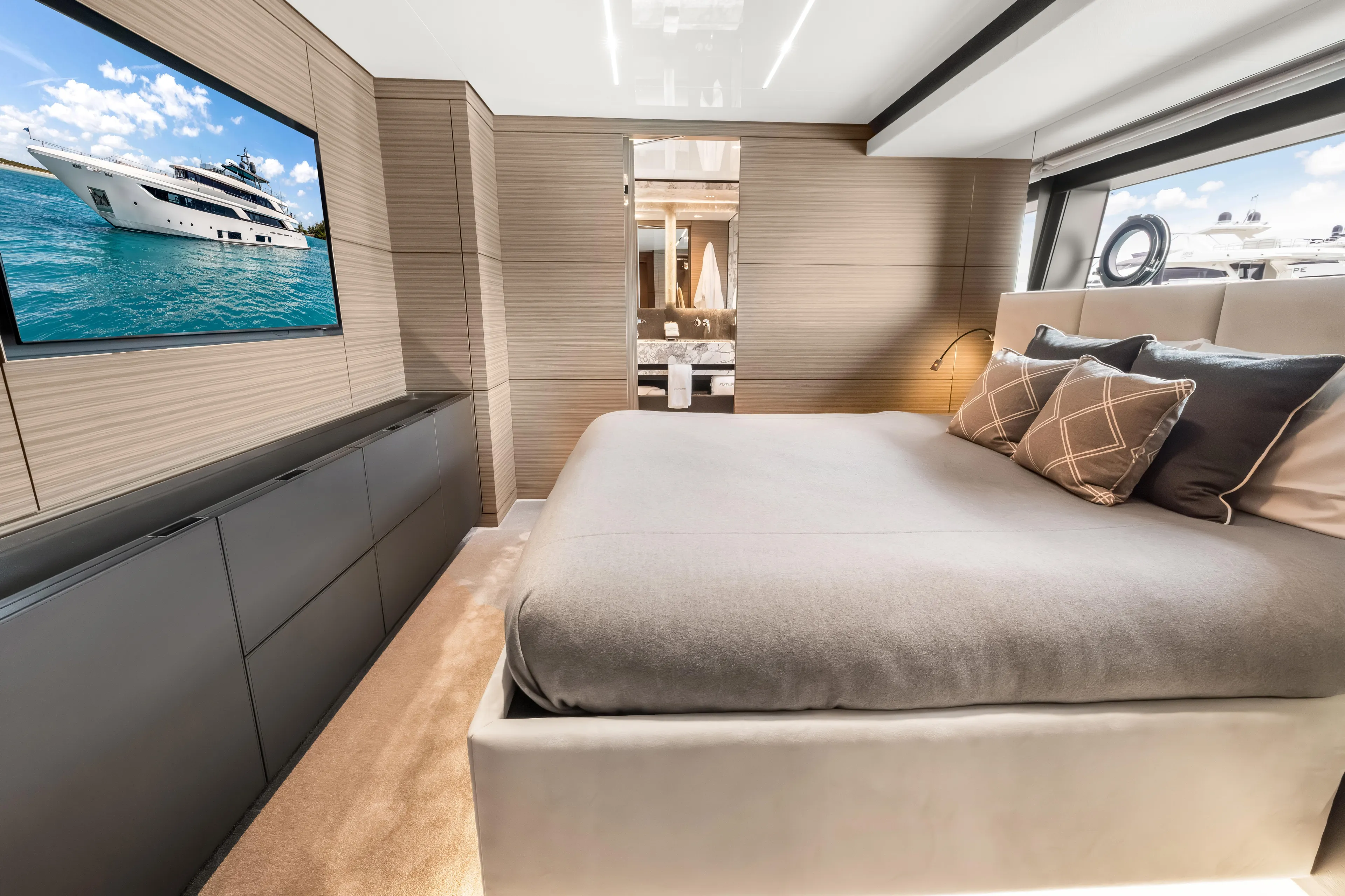 Navetta Yacht Photos Pics Luxurious bedroom interior of 2023 Custom Line NAVETTA 42 yacht with modern design elements.