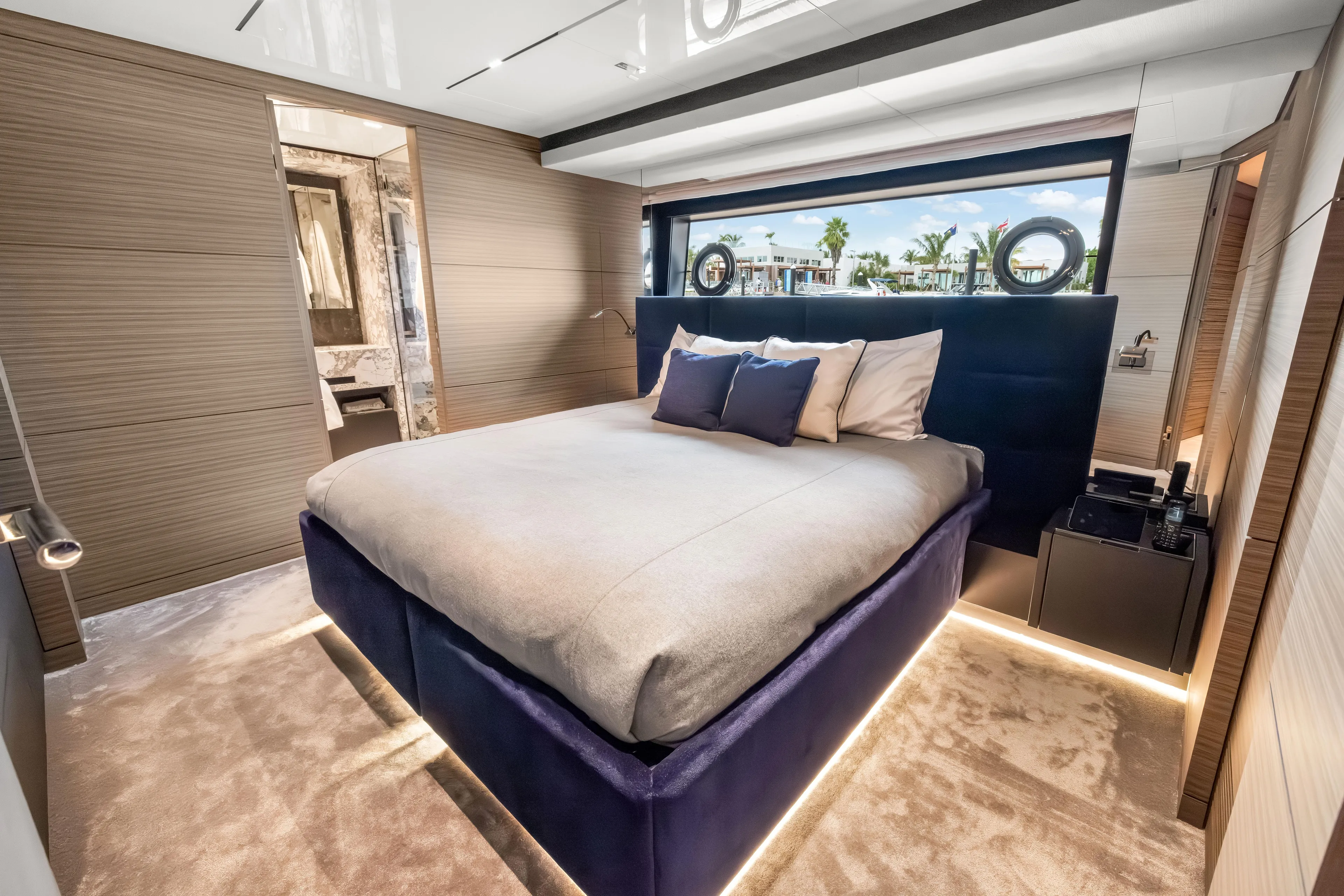 Navetta Yacht Photos Pics Luxurious bedroom interior of 2023 Custom Line NAVETTA 42 yacht with modern design.