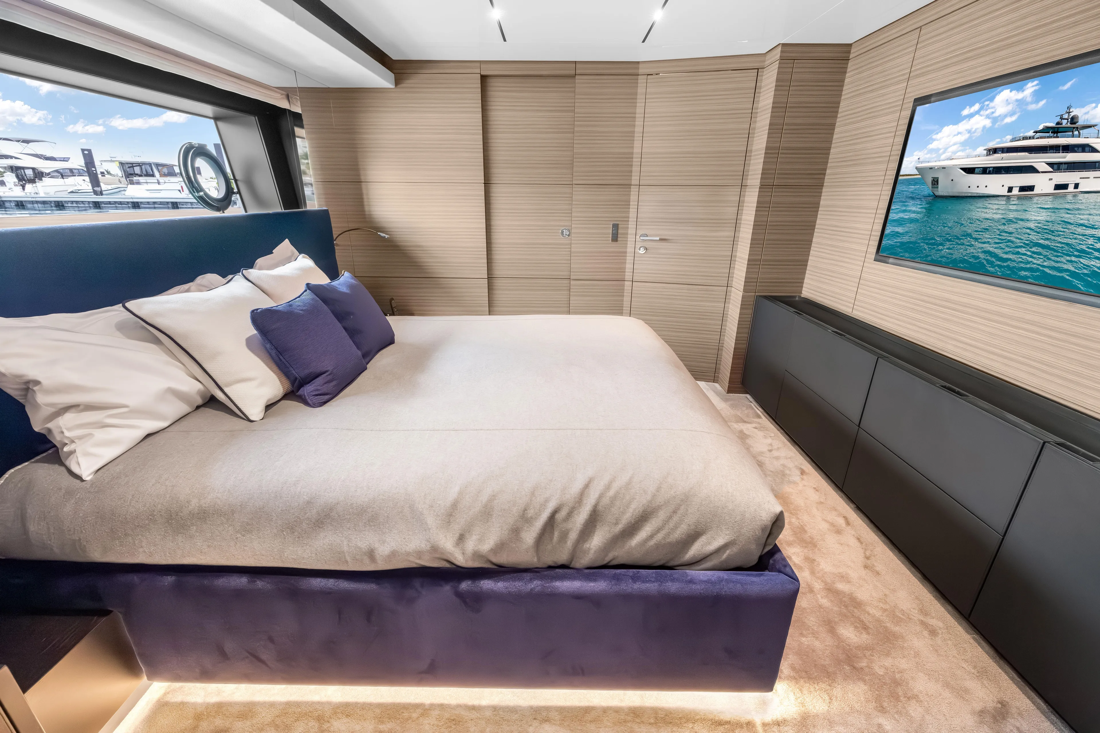 Navetta Yacht Photos Pics Luxurious bedroom interior of 2023 Custom Line NAVETTA 42 yacht with modern design elements.