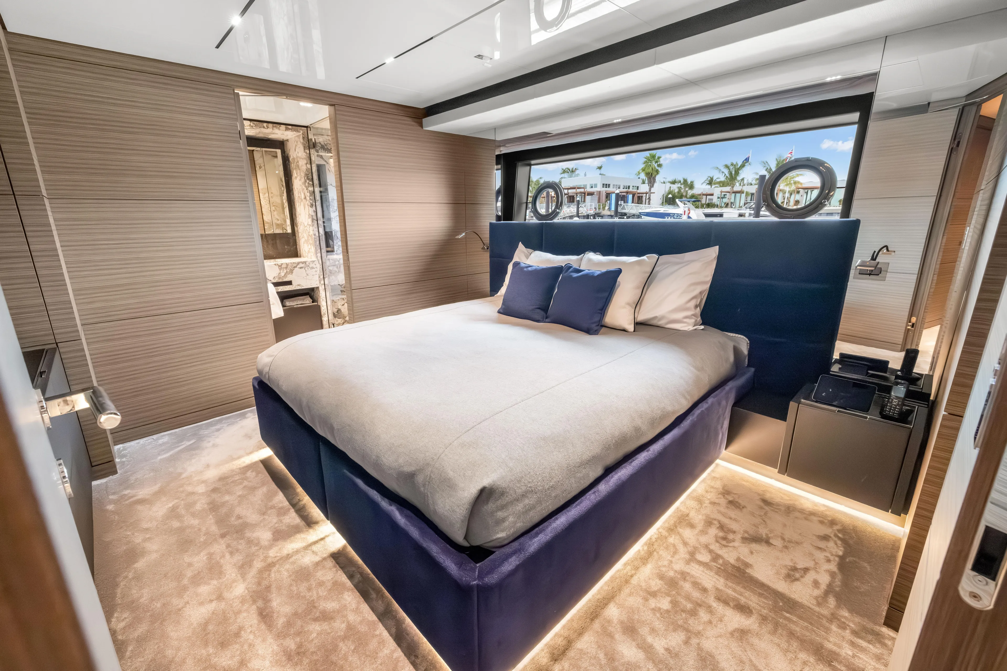 Navetta Yacht Photos Pics Luxurious bedroom interior of 2023 Custom Line NAVETTA 42 yacht with modern design.