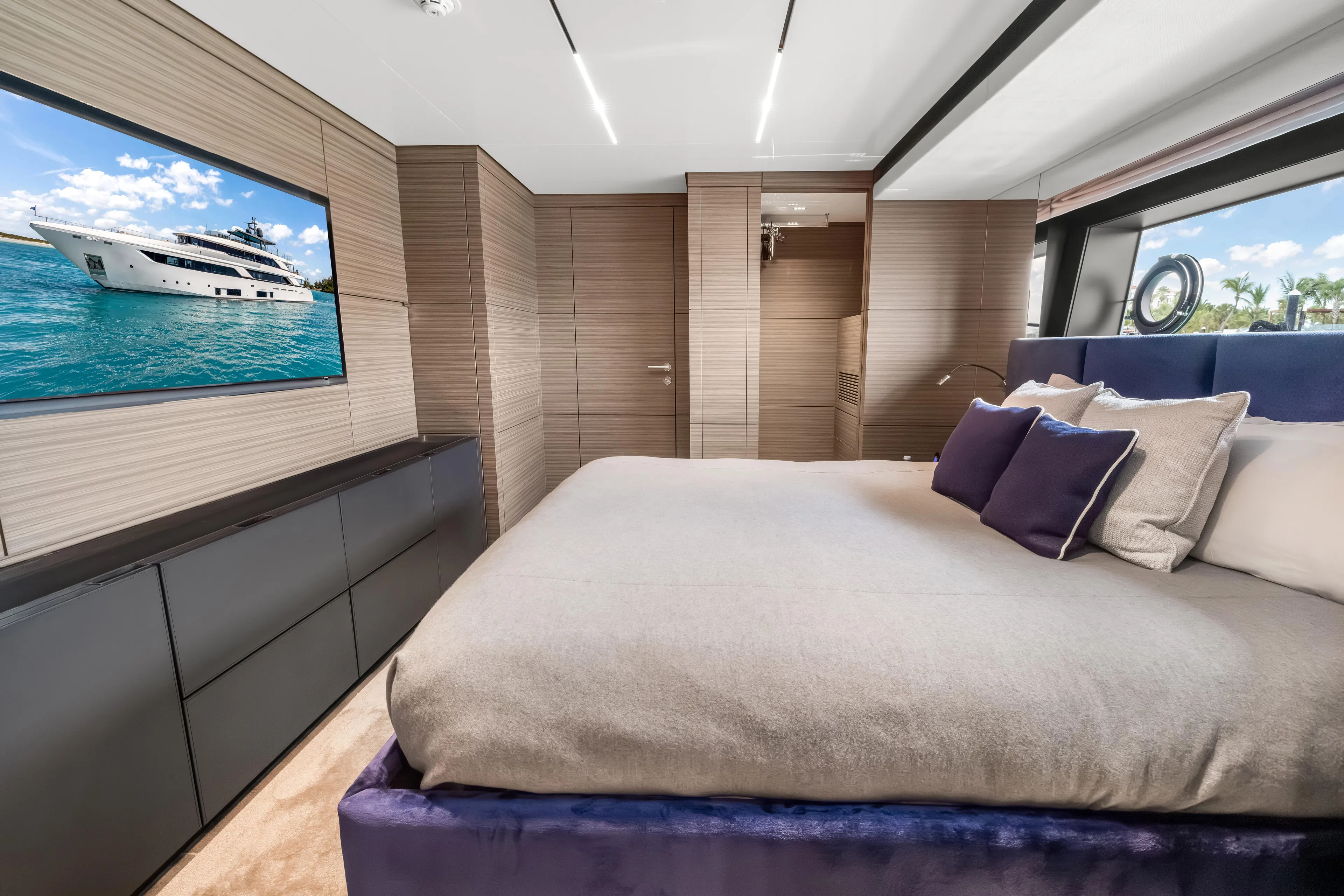 Navetta Yacht Photos Pics Luxurious bedroom interior of 2023 Custom Line NAVETTA 42 yacht with modern design elements.