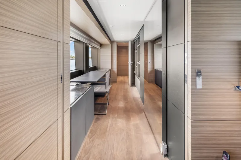 Navetta Yacht Photos Pics Luxurious interior of 2023 Custom Line NAVETTA 42 yacht with modern design and wood finishes.