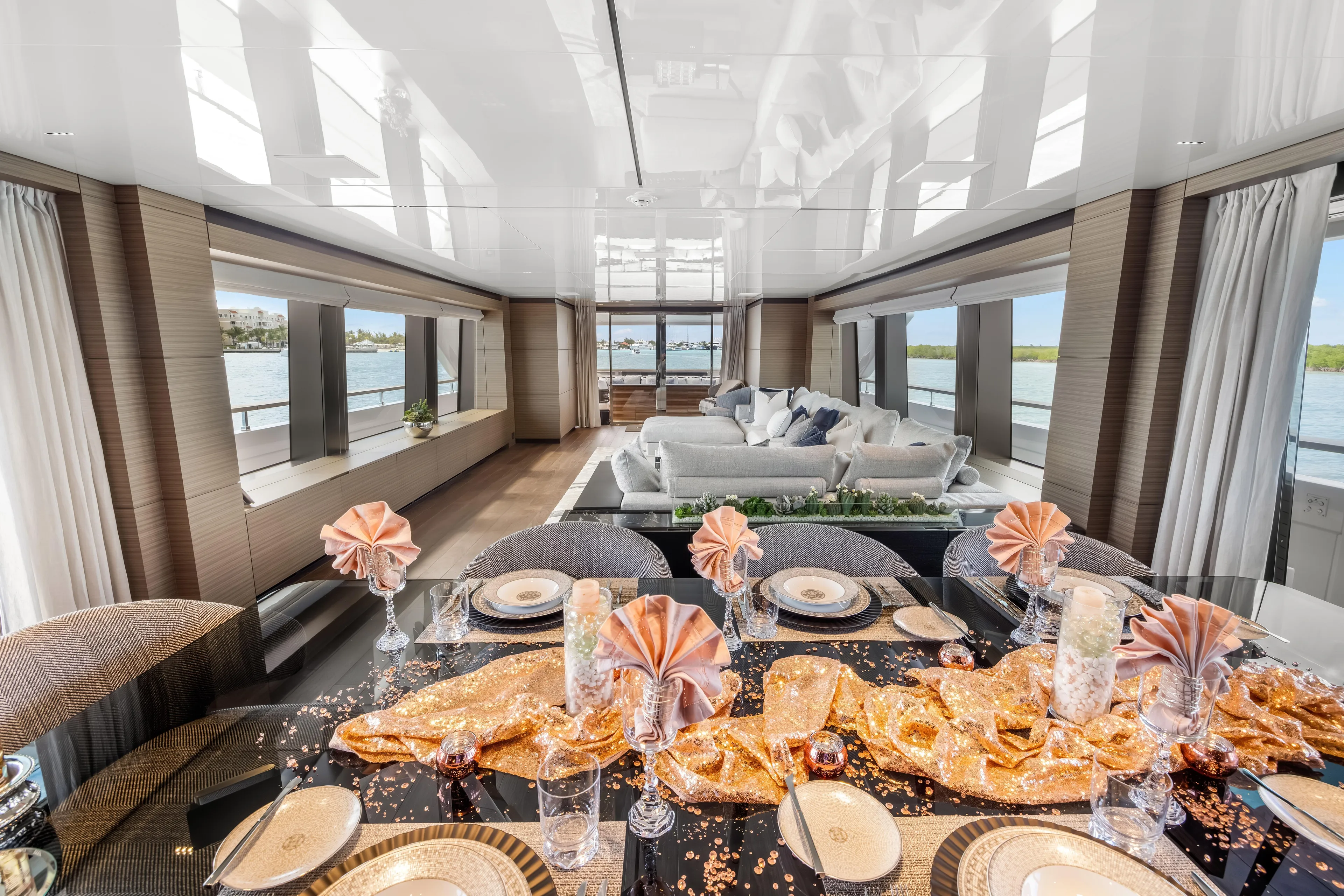 Navetta Yacht Photos Pics Luxurious interior of 2023 Custom Line NAVETTA 42 yacht with elegant dining setup.