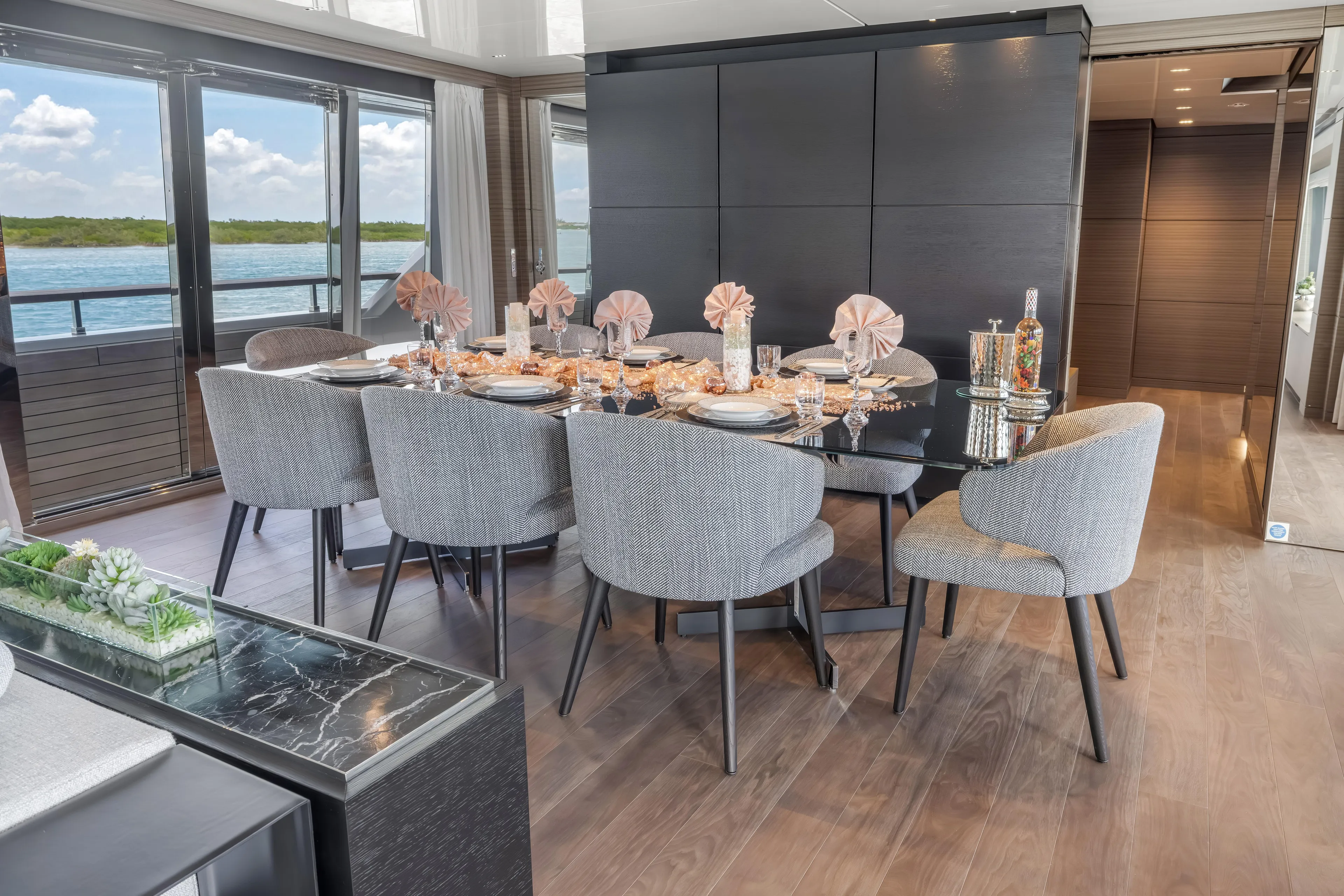 Navetta Yacht Photos Pics Luxurious dining area on 2023 Custom Line NAVETTA 42 yacht with elegant table setting.