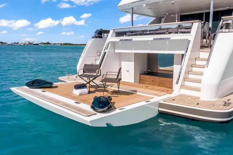 Navetta Yacht Photos Pics Luxurious 2023 Custom Line NAVETTA 42 yacht with elegant deck and ocean view.