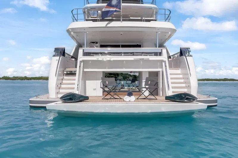 Navetta Yacht Photos Pics Luxury yacht NAVETTA 42, 2023 model, with open deck and seating on calm blue waters.