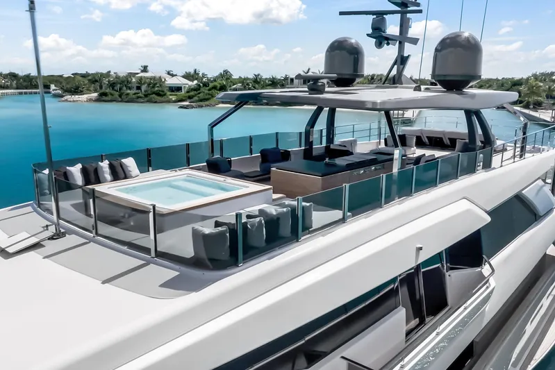 Navetta Yacht Photos Pics Luxurious 2023 Custom Line NAVETTA 42 yacht with jacuzzi, sleek design, and stunning ocean view.